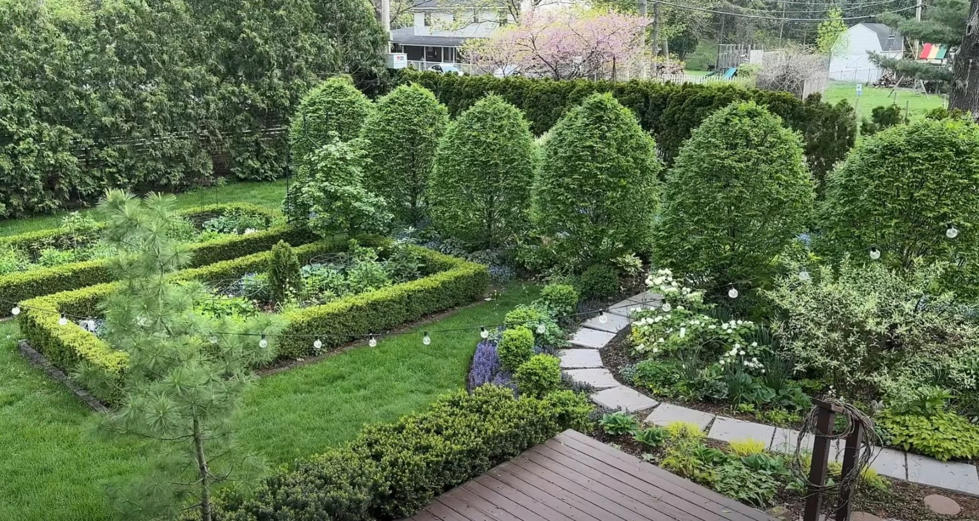 Aerial view of structured garden with geometric hedging