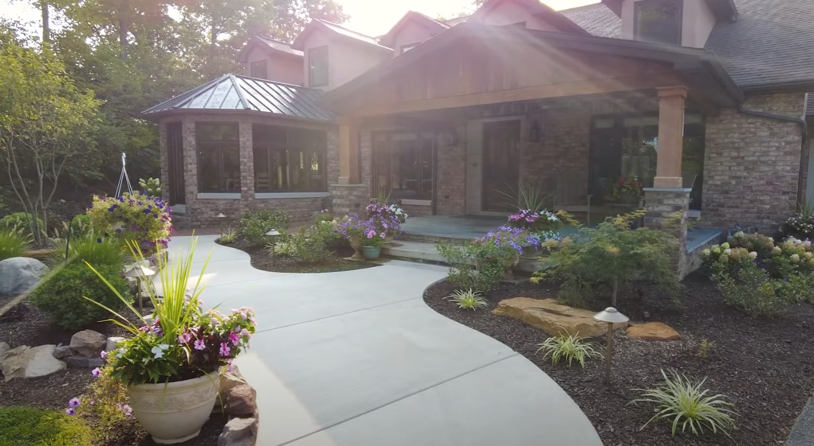 Beautiful front yard landscape design with curved pathways and colorful plantings